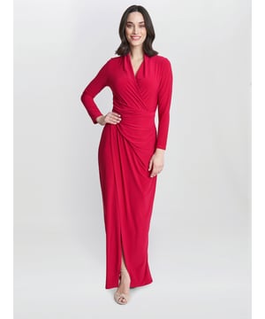 Our new modern jersey dress features a ruched waist and wrap effect. This dress is partially lined. Perfect to dress up or down.
