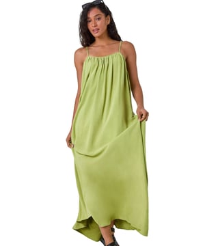 Dusk Woven Strappy Maxi Dress from Roman. Float effortlessly through the Spring Summer season in our trendy strappy maxi dress. Falling to a comfortable maxi length, this dress features a flowy A-line shape and sleeveless silhouette. Cut from a smooth woven fabric with a touch of linen, it will keep you airy and light. Perfect for your beach getaway or casual days out, style this versatile dress with strappy sandals and a light jacket for a laid-back look!