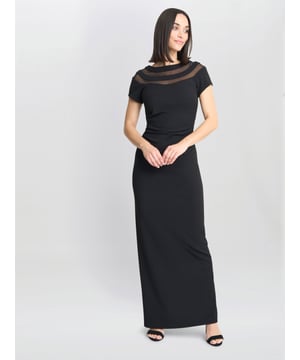 A simple yet glamourous dress by Gina Bacconi. This dress features at-shirt shape, illusion neck line and back rushing. This dress is is lined.