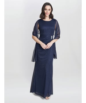 A wardrobe essential this elegant and timeless maxi dress and matching scarf set comes in a delicate mesh with subtle glitter detail to add to the glamour. It features flattering tucks over the waist and a beautiful diamante trim. The perfect dress for that special occasion.