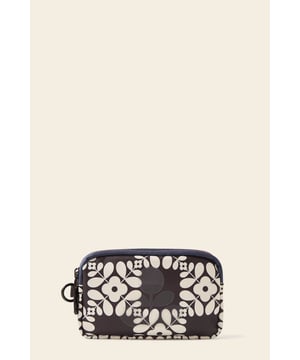 Introducing the Iota Phone Case, a compact essential for your on-the-go lifestyle. With two equal-sized zip compartments and a small internal slip pocket, there’s room for all your small necessities. Featuring Orla Kiely’s signature flower polka dot print in recycled polyester, this piece combines practicality with a touch of creative flair.