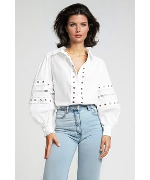 The one you can wear anywhere, with anything, in any season. This boho gypsy shirt features striking silver eyelet detailing with an ibiza vibe. Cut with an open neck collar finished with long puffed sleeves, the cuffs add a touch of sophistication.

As clearance stock they may not be in original packaging.