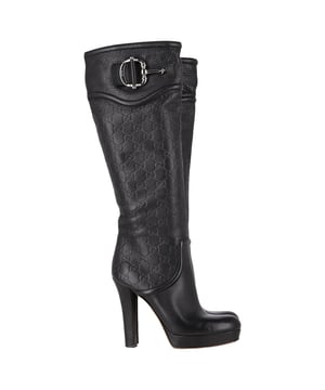 VINTAGE, RRP AS NEW
 Make a bold statement with the Gucci Guccissima Platform Knee-High Boots, crafted in sleek black leather and embossed with the iconic monogram. The dramatic platform and towering heel elevate any outfit—literally and stylistically—while exuding luxury from every angle. **Styling Tip:** Let the boots shine by pairing them with a fitted mini dress or leather skirt for an edgy, fashion-forward look.

Gucci Guccissima Platform Knee-High Boots in Black Leather

Condition: Very good
Signs of wear: Minor markings, Lightly used but very well maintained. Minor mark at soles & creasing, light scuffing at the soles and heels.
Packaging: None
Color: Black
Material: Leather | leather
Size: IT | 38.5
Measurements: Heel height: 120; Insole length: 270
SKU: NAPPUGBSH489764W