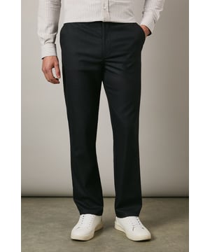 Textured woven fabric with added stretch for enhanced comfort and movement
        Clean-cut straight leg design offering a smart, versatile silhouette
        Side slash pockets for practicality without compromising the sleek appearance
        Rear welt pockets adding refined detail to the tailored look
        Smooth waistband with belt loops for a customised fit
    
    These Maine textured trousers combine sophistication with practicality, making them an essential addition to your smart wardrobe. The subtle texture adds visual interest while the added stretch ensures day-long comfort whether you're in meetings or attending formal gatherings. Style them as shown with a light-coloured button-down shirt for a crisp office look, or pair with a fine knit jumper for smart-casual occasions. The versatile straight leg cut works brilliantly with both formal shoes and white trainers for a contemporary twist on traditional tailoring. Perfect for work environments, important presentations, or evening events where you need to convey polish without appearing overdressed. These trousers transition effortlessly from day to evening, maintaining their shape and smart appearance throughout.