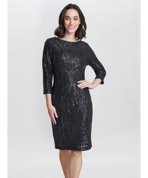 This charcoal black sequined fitted dress is an easy to wear, eye catching style for the season ahead! Perfect with or without tights and a heel or sandal.