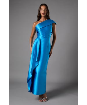 Striking one-shoulder design with elegant folded detail across the bodice
        Sophisticated column silhouette with a dramatic side waterfall drape
        Structured twill fabric that maintains its shape throughout the evening
        Back split detail for ease of movement and added allure
        Floor-length style perfect for formal black tie occasions
    
    This captivating Coast one-shoulder dress commands attention with its architectural design and refined silhouette. The asymmetric neckline creates a contemporary focal point, while the structured column shape flatters the figure with understated elegance. The cascading side drape adds movement and drama to your ensemble, ensuring you stand out at any formal gathering. Style with metallic strappy heels and statement earrings as shown for a sophisticated black tie look. Perfect for weddings, galas, or race day events where making an impression matters. The clean lines and thoughtful construction reflect timeless British elegance while offering a modern twist. This versatile evening piece transitions beautifully from champagne reception to dance floor, maintaining its polished appearance throughout your special occasion.