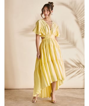 Striking cut-out back design with tie detail for a sophisticated reveal
        Elegant V-neckline with delicate front tie closure
        Dramatic high-low hemline creating beautiful movement
        Tiered skirt construction adding volume and dimension
        Flutter short sleeves for a feminine, graceful silhouette
    
    This captivating Coast maxi dress commands attention with its thoughtful design elements perfect for your next special occasion. The cotton voile fabric offers a lightweight feel with gentle structure, whilst the cinched waist creates a flattering silhouette that complements all figures. Style with metallic strappy sandals and statement earrings as shown for race day sophistication, or pair with delicate jewellery and an embellished clutch for wedding guest perfection. The versatile high-low hemline allows for effortless movement on the dance floor whilst maintaining an elegant profile during formal proceedings. This dress transitions beautifully from daytime garden parties to evening celebrations, making it a wardrobe essential for the social season ahead.