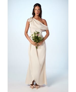 Elegant one-shoulder neckline with a graceful bow detail
        Flattering fallen shoulder design for a modern twist
        Floor-sweeping maxi length for a dramatic silhouette
        Luxurious satin fabric that drapes beautifully
        Fitted waist to accentuate your figure
    
    This stunning bridesmaids maxi dress from Coast is the epitome of sophistication and grace. Perfect for your role in the bridal party, it combines timeless elegance with contemporary flair. The one-shoulder neckline, adorned with a charming bow detail, creates a captivating focal point, while the fallen shoulder adds a touch of modern allure. The floor-length silhouette ensures a dramatic entrance, flowing gracefully as you walk down the aisle. Pair with delicate strappy heels and understated jewellery to complement the dress's refined aesthetic. For a cohesive bridal party look, coordinate with your fellow bridesmaids in matching or complementary hues, creating a stunning visual harmony that will be remembered long after the wedding bells have rung.