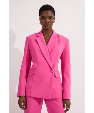 This Karen Millen asymmetric wrap blazer redefines daywear tailoring with its contemporary twist on a classic. The structured shoulders and tailored fit create a flattering silhouette, whilst the stretch fabric ensures all-day comfort without compromising on style. As seen on our model, pair with coordinating wide-leg trousers for an effortlessly chic monochromatic ensemble, or contrast with slim-fit denim for a smart-casual approach. Complete your look with statement jewellery and oversized sunglasses for brunch dates, or style with a structured tote and flat sandals for gallery visits and shopping trips. The versatile design transitions seamlessly from office meetings to weekend gatherings, making it an indispensable addition to your capsule wardrobe. Layer over a silk camisole or fine knit depending on the season for maximum styling flexibility.  Distinctive asymmetric wrap design with elegant stab stitch detailing Tailored silhouette with structured shoulders for a refined look Collared neckline with notched lapels adding classic sophistication Stretch fabric construction allowing comfortable movement throughout the day Functional side pockets perfect for small essentials