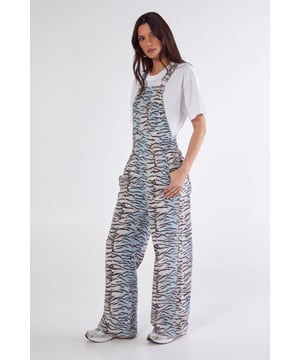 Striking tiger print denim dungarees with adjustable shoulder straps
        Wide-leg silhouette for maximum comfort and contemporary style
        Front bib pocket detail adds practical functionality
        Cross-back design with classic dungaree fastening
        100% cotton denim construction for breathable comfort
    
    Make a bold statement with these eye-catching tiger print dungarees from NastyGal. The relaxed wide-leg cut creates a flattering silhouette while maintaining ultimate comfort for nights out. Style with a simple white tee as shown for daytime casual, or transform your look for evening by pairing with a fitted bodysuit and chunky platform trainers. The versatile design works brilliantly for urban nightlife - perfect for bar-hopping or dancing the night away at your favourite club. The cross-back design and adjustable straps ensure a customised fit that moves with you. These dungarees offer the perfect balance of standout style and practical comfort, making them an essential addition to your going-out wardrobe.