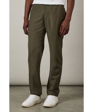 Linen blend trousers with a relaxed straight-leg silhouette for all-day comfort
        Clean front design with button fastening for a sleek, minimalist look
        Practical side pockets perfect for everyday essentials
        Rear pockets add functionality while maintaining the clean-cut appearance
        Versatile mid-rise waist that sits comfortably on the hips
    
    These Burton linen blend trousers combine casual comfort with understated style, making them a wardrobe essential for the modern man. The breathable fabric blend creates a lightweight feel that's ideal for warmer days whilst maintaining structure and shape throughout wear. Style them as shown with crisp white trainers and a simple tee for relaxed weekend outings, or dress them up with a short-sleeve button-down shirt for garden parties and casual gatherings. The straight-leg cut offers a timeless silhouette that works equally well for a day at the cricket as it does for after-work drinks at your local. These trousers transition effortlessly from daytime casual to evening socialising, making them a versatile addition to your wardrobe that will serve you well season after season. Machine washable for easy care, they're designed to become a reliable favourite in your regular rotation.