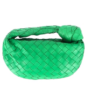 VINTAGE, RRP AS NEW
Elevate your accessory game with the Bottega Veneta Mini Jodie in Green Intrecciato Leather. This iconic bag is a true statement piece that exudes luxury and sophistication. The intricate woven leather detailing in a rich green hue adds a pop of artisanal elegance to any outfit. Whether paired with a casual daytime look or a chic evening ensemble, this mini bag is the epitome of refined style. Its compact size makes it perfect for carrying your essentials while maintaining an effortlessly elegant silhouette. Pair it with a neutral-toned tailored jumpsuit for a contemporary and polished look that seamlessly transitions from day to night.

Bottega Veneta Mini Jodie in Green Intrecciato Leather
Condition: Good
Signs of wear: Some black marks on exterior and interior surface
Packaging: Dust bag
Color: Green 
Material: Leather | leather
Size: One Size | One Size
Measurements: Width: 50; Height: 130; Length: 260; Handle drop: 50; Strap length: 0
SKU: NAPPUGBBA424692W