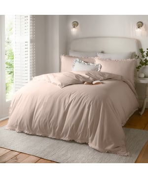 Transform your bedroom into a calm, soothing retreat with the Tilly Ruffle Duvet Cover Set. Crafted from luxuriously soft, breathable tumbled cotton with a 144 thread count, it ensures comfort throughout the seasons while inviting restful sleep. The subtle ruffle trim on the duvet and pillowcases adds a touch of timeless charm, blending effortlessly with both classic and modern interiors. Designed for those who cherish understated elegance, this minimalistic set brings a sense of effortless sophistication to your space, creating a serene sanctuary where style and comfort meet seamlessly.