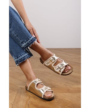 Slide into effortless summer style with these Andi Chunky Flatform Sandals With Cutout Straps, crafted for comfort and standout design. Featuring bold contrast embroidery and dual adjustable buckle straps, they blend both charm with practicality. The cork-style footbed provides arch support, ideal for holidays, festivals, or casual city strolls. Key Features: • Material: Faux leather upper with a soft suede-effect footbed and cork midsole • Design: Dual-strap slide with decorative stitching and metallic buckles • Closure: Adjustable twin buckle straps for a secure and personalized fit