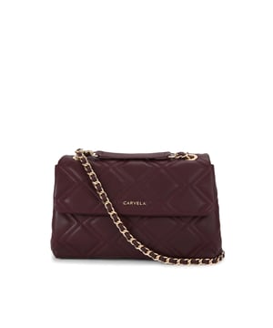 The Carvela Large Rosa Chain shoulder bag features a dark red exterior with overstitch quilting in a diamond design. There is gold tone branding on the front and hardware details across the bag. Dimensions: 17cm (H), 26cm (L), 7cm (D). Strap length: 63cm.