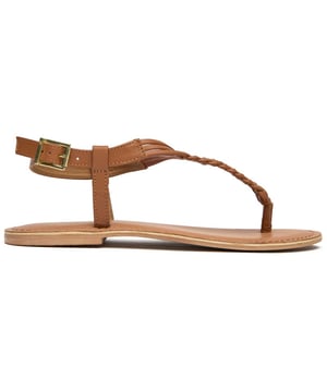 The Sole Dulce Thong offers understated elegance for warm-weather adventures. Crafted with a supple leather upper in a versatile tan shade, these women's flat sandals combine style with all-day comfort. The thoughtfully designed padded leather insole cradles your feet, while the practical synthetic sole provides reliable traction. With their quality leather lining and minimalist thong design, these sandals effortlessly complement everything from casual shorts to breezy summer dresses.