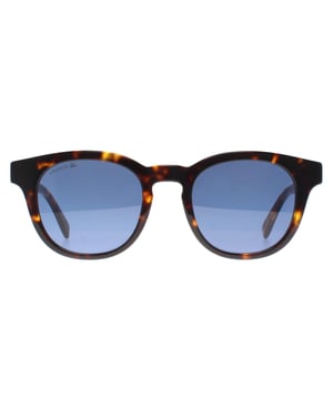 Lacoste Round Mens Dark Havana Blue L6006S  Sunglasses blend timeless design with modern functionality. Featuring a full-rim oval frame crafted from lightweight acetate, they offer both durability and comfort. Equipped with smoke-tinted lenses, these sunglasses provide 100% UV protection, ensuring optimal eye safety in bright conditions. The iconic Lacoste crocodile logo adorns the temples, adding a touch of brand heritage to the sleek design.