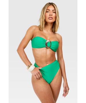 Bandeau-style bikini top with eye-catching gold-tone hardware
        High-waisted bottoms for a flattering silhouette
        Textured fabric adds visual interest and depth
        Strapless design perfect for minimising tan lines
        Versatile two-piece suitable for various beach activities
    
    Make waves this summer in this striking bandeau bikini set from Boohoo. The strapless top features a bold gold-tone accent, adding a touch of glamour to your beach ensemble. Paired with high-waisted bottoms, this swimwear set offers both style and comfort for your seaside adventures. The textured fabric adds a luxurious feel, while the classic design ensures you'll stand out whether you're lounging by the pool or taking a dip in the sea. Accessorise with oversized sunglasses and a wide-brimmed hat for the ultimate resort look. Perfect for your next sunny getaway or a day at the local lido, this bikini set is a must-have addition to your summer wardrobe. Its versatile design allows for easy mixing and matching with other swimwear pieces, giving you multiple styling options throughout the season.