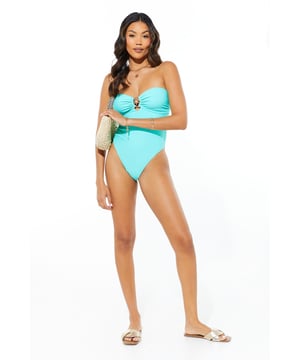 Chic bandeau neckline for a tan-line free look
        Striking striped pattern for a nautical-inspired aesthetic
        Decorative starfish detail at the centre bust
        Figure-flattering one-piece design
        High-cut leg for an elongated silhouette
    
    Make waves this summer in our captivating Bandeau Starfish Swimsuit. This striking one-piece radiates seaside glamour with its bold striped pattern and eye-catching starfish embellishment. The bandeau neckline offers a sleek, modern look while providing ample support for your beach adventures. Perfect for lounging by the pool or taking a dip in the sea, this swimsuit is versatile enough for any sunny day activity. Style it with oversized sunglasses and a wide-brimmed hat for ultimate poolside chic, or throw on a breezy kaftan and sandals for a stylish beach bar ensemble. Whether you're jetting off to a tropical paradise or enjoying a staycation, this swimsuit will ensure you look and feel fabulous under the sun.