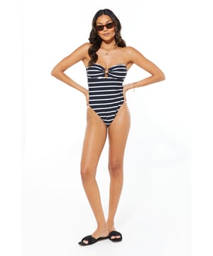 Chic bandeau neckline for a tan-line free look
        Striking striped pattern for a nautical-inspired aesthetic
        Decorative starfish detail at the centre bust
        Figure-flattering one-piece design
        High-cut leg for an elongated silhouette
    
    Make waves this summer in our captivating Bandeau Starfish Swimsuit. This striking one-piece radiates seaside glamour with its bold striped pattern and eye-catching starfish embellishment. The bandeau neckline offers a sleek, modern look while providing ample support for your beach adventures. Perfect for lounging by the pool or taking a dip in the sea, this swimsuit is versatile enough for any sunny day activity. Style it with oversized sunglasses and a wide-brimmed hat for ultimate poolside chic, or throw on a breezy kaftan and sandals for a stylish beach bar ensemble. Whether you're jetting off to a tropical paradise or enjoying a staycation, this swimsuit will ensure you look and feel fabulous under the sun.