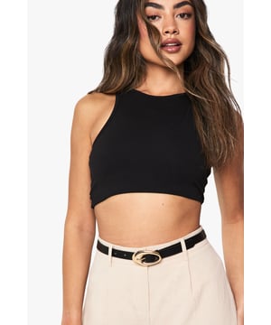 Striking abstract gold buckle design for a contemporary statement
        Sleek, slim belt profile perfect for cinching waistlines
        Versatile adjustable fit with multiple notch holes
        Smooth PU construction offering durability and easy maintenance
        Distinctive curved buckle shape adding visual interest to any outfit
    
    This Abstract Gold Buckle Belt from Boohoo is the perfect finishing touch to transform your everyday ensembles. The distinctive curved gold buckle creates a modern focal point that instantly refreshes basics. Style it with high-waisted trousers as shown for a polished silhouette, or thread through belt loops of your favourite jeans for casual outings. The versatile black strap complements any colour palette in your wardrobe, making it an essential accessory for family gatherings and weekend brunches. For a coordinated look, pair with gold-toned jewellery and a structured handbag. This belt works brilliantly to define the waist of floaty dresses or to add interest to simple separates - the styling possibilities are endless for this wardrobe staple that bridges the gap between functionality and fashion-forward design.