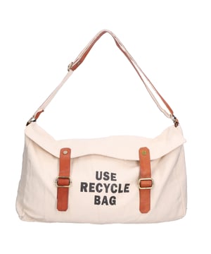 Bolso bandolera de mujer en piel genuina + lona. Producto construido íntegramente con materiales de recuperación y/o reciclados.