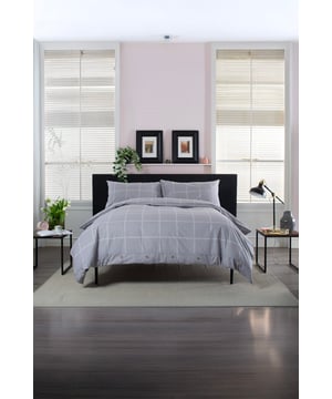 The Crossley Heath Duvet Set is crafted from 100% pure cotton for a naturally soft and breathable feel, featuring a timeless grid print complemented by piped cuffs and mock horn button detailing for a refined finish. With a 144 thread count, it offers the perfect balance of durability and comfort, making it ideal for everyday use and all-season appeal.