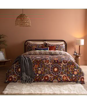 Turn your bedroom into a cosy, artistic retreat with the Kinfolk Duvet Cover Set. Inspired by the timeless charm of traditional Central-Asian Suzani textiles, this reversible design features elegant vines, floral medallions, and pomegranates in a rich palette. Made from a durable cotton blend, it’s soft, comfy, and built to last. Flip it over for a geometric tile design and switch up the look anytime. The Kinfolk duvet set isn’t just bedding, it’s the stylish centrepiece your room deserves.