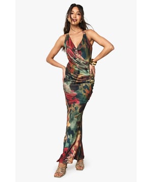 Striking floral print mesh maxi dress with elegant halterneck design
        Flattering waterfall neckline that creates a dramatic drape effect
        Figure-enhancing ruched detailing along the bodice
        Floor-sweeping length with a subtle fishtail hem for added movement
        Tie-back fastening for an adjustable and secure fit
    
    Make a statement at your next night out in this show-stopping floral halterneck maxi dress. The waterfall neckline creates a captivating drape that frames your dcolletage beautifully, whilst the ruched detailing accentuates your silhouette in all the right places. Style with strappy metallic heels and a compact clutch as shown for a head-turning club ensemble. The mesh fabric offers comfortable stretch whilst maintaining its shape throughout the night. For cooler evenings, layer with a cropped jacket and add statement bangles to complete your look. This versatile piece transitions effortlessly from cocktail bars to dance floors, ensuring you remain the centre of attention wherever the night takes you.