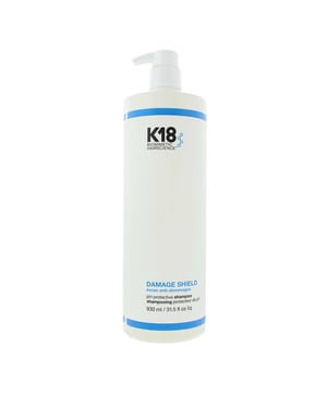 K18 Damage Shield pH Protective Shampoo is a color-safe, pH-optimized shampoo designed to gently cleanse while protecting hair from damage caused by environmental stressors, styling, and chemical treatments. This science-backed formula helps maintain the hair’s natural moisture balance and cuticle health by working within the ideal pH range (4.5–5.5), minimising swelling of the hair shaft and preserving strength and color vibrancy.

Key Benefits

pH-balanced to protect the hair fibre and maintain scalp health
Gently removes dirt, excess oil, and product build-up without stripping
Helps preserve colour, keratin treatments, and the integrity of chemically treated hair
Strengthens hair and reduces damage over time when used consistently
Safe for daily use and suitable for all hair types

Free From
Sulfates
Parabens
Silicones
Colorants
Heavy waxes or fillers

How to Apply

Wet hair thoroughly. Apply a small amount of K18 Damage Shield Shampoo to the scalp and roots.

Massage gently with fingertips to lather, working the product through the hair.

Rinse thoroughly.

Pro Tip: For best protection, use consistently—especially before and after chemical treatments, heat styling, or exposure to environmental stress like sun, salt, or pollution.