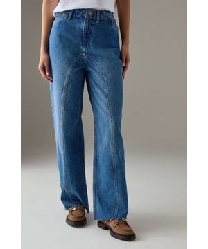 Distinctive raw waist seam detail creates a contemporary silhouette
        Relaxed dad jean fit offers exceptional comfort for all-day wear
        Washed denim finish gives these jeans a lived-in, authentic look
        Practical rear patch pockets add functionality to the design
        Wide leg shape with a subtle flare complements various body types
    
    These Warehouse dad jeans redefine casual cool with their distinctive seam detailing and relaxed silhouette. The washed denim construction offers both durability and comfort, making them perfect for your everyday rotation. Style them as seen with a crisp white t-shirt for an effortlessly chic look, or dress them up with a fitted blouse and ankle boots for evening drinks. The versatile wide-leg shape pairs brilliantly with chunky loafers for a nod to 90s nostalgia, or trainers for running weekend errands. These jeans shine at casual gatherings where comfort meets style - think Sunday brunches, shopping trips with friends, or relaxed family gatherings. Their timeless appeal and cotton composition ensure they'll remain a wardrobe staple for seasons to come, adapting seamlessly to your personal style journey.
