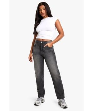 Slim-fit design that flatters the silhouette while offering comfortable movement
        Classic five-pocket styling with functional front and back pockets
        Mid-rise waistband with button and zip fastening for secure fit
        Subtle faded effect creates a lived-in, versatile look
        Straight leg cut with full-length design that sits neatly at the ankle
    
    These essential slim-fit jeans are the cornerstone of any capsule wardrobe, offering endless styling possibilities for your everyday rotation. The streamlined silhouette creates a flattering profile without sacrificing comfort, thanks to the touch of stretch in the cotton-rich fabric. Style them casually with a cropped tee and trainers for daytime outings, or dress them up with a blouse and ankle boots for evening gatherings. The versatile wash works brilliantly with both neutral tones and vibrant colours, making these jeans a true wardrobe hero. Perfect for family gatherings, weekend brunches or casual Fridays at work, these jeans deliver that effortless cool-girl aesthetic that's signature to the Boohoo brand. Their timeless design ensures they'll remain a staple in your collection season after season.