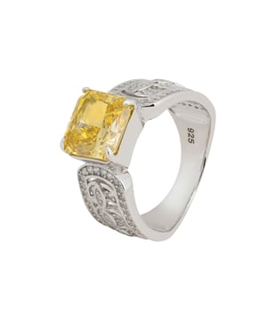 Experience the radiant beauty of the Rowena Cocktail Ring, a dazzling piece crafted from the finest 925 sterling silver. The band is a masterpiece, featuring intricate open fretwork adorned with sparkling zircon, creating a harmonious blend of sophistication and a lightweight feel that ensures all-day comfort.The highlight of this stunning ring is a lab-grown Yellow Topaz, measuring 1.0cm x 1.0cm. Known for its warm, golden hue, Yellow Topaz is the birthstone for November, symbolizing joy and abundance. Its vibrant colour evokes the brilliance of a sunlit afternoon, adding a touch of warmth and elegance to any outfit.Weighing just 7.1 grams, the Rowena Cocktail Ring combines luxurious appeal with effortless wearability. Available in four sizes, it ensures a perfect fit for every wearer. Enhance your jewellery collection with the Rowena Cocktail Ring and let the golden glow of Yellow Topaz illuminate your fingers. This exquisite piece brings a touch of timeless elegance and radiant charm, making it an essential addition to your collection.