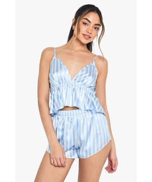 Stylish two-piece pyjama set featuring a flattering cami top with delicate spaghetti straps
        Feminine V-neckline with gathered detail under the bust for a flirty silhouette
        Flowy peplum-style hem on the top adds a touch of playful movement
        Matching shorts with comfortable elasticated waistband for ease of wear
        Lightweight woven fabric with classic stripe pattern for a timeless nightwear look
    
    Drift off to dreamland in this charming cami and shorts pyjama set from Boohoo. The relaxed fit and breezy fabric ensure maximum comfort for those warm summer nights, whilst the pretty striped pattern adds a touch of classic style to your nightwear collection. The feminine peplum detail on the top creates a flattering silhouette that's both cute and comfortable. Perfect for lounging at home on lazy weekend mornings or packing for your next holiday getaway. Pair with fluffy slippers and a lightweight dressing gown for those midnight kitchen trips, or simply enjoy the cool comfort against your skin as you settle in for a restful night's sleep. This versatile set transitions effortlessly from night to morning, making it an essential addition to your nightwear drawer.