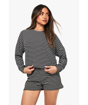 Relaxed fit long-sleeved jersey top with classic horizontal stripe pattern
        Dropped shoulder design for effortless comfort and contemporary silhouette
        Matching shorts with comfortable elastic waistband for ease of movement
        Soft knitted jersey fabric that's gentle against the skin
        Versatile two-piece set that can be worn together or styled separately
    
    Embrace laid-back luxury with this striped jersey co-ord set from Boohoo. The oversized long-sleeved top features a relaxed fit with dropped shoulders that creates an effortlessly chic silhouette, whilst the matching shorts offer the perfect balance of comfort and style. Perfect for those cosy nights in when you still want to look put-together, this set is ideal for lounging, weekend brunches at home, or casual film nights with friends. Style with fluffy socks and your favourite oversized cardigan when temperatures drop, or wear the pieces separately to maximise your wardrobe options. The timeless stripe pattern ensures this set will remain a staple in your loungewear collection for seasons to come, whilst the soft knitted fabric provides that much-needed comfort for your downtime moments.