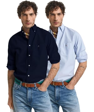 Introducing Enzo Milano Men's Shirts: the epitome of luxury. Impeccably crafted with lightweight, breathable cotton, these Regular Fit shirts feature a sophisticated Button-Down Collar and Long Sleeves for a timeless look. Each shirt is adorned with the Enzo Milano Logo, embroidered on the chest for a touch of exclusivity