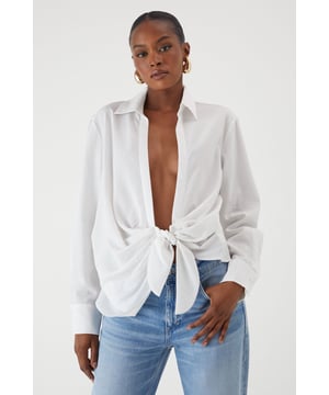 Oversized fit with distinctive side tie detail for versatile styling options
        Textured linen-look fabric offering a relaxed yet polished appearance
        Classic collar design with full-length sleeves for timeless appeal
        Coordinating shorts create a chic co-ord set perfect for warm-weather occasions
        Relaxed silhouette allows for effortless movement and comfort
    
    This linen-look shirt from MissPap delivers effortless style with its contemporary oversized fit and distinctive side tie detail. The versatile piece can be styled multiple ways - wear it tied at the front with the matching shorts for a coordinated daytime look, or leave it unbuttoned over a crop top and denim shorts for casual gatherings. For a touch of glamour, pair with slim-fit trousers and strappy heels. The textured fabric creates a breezy, summery vibe that's ideal for family barbecues, brunches with the girls, or seaside holidays. Complete the ensemble with statement sunglasses and minimal jewellery for a look that's both relaxed and fashion-forward. The shirt's adaptable nature makes it a wardrobe essential that transitions seamlessly from day to evening, simply by changing your accessories and footwear.