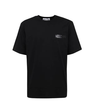 Elevate your casual wardrobe with the Moschino Black T-Shirt, featuring the iconic Moschino logo patch for a bold, stylish statement. Crafted from high-quality fabric, this t-shirt offers exceptional comfort and durability, making it perfect for everyday wear. Its sleek black design pairs effortlessly with any outfit, while the distinctive logo patch adds a touch of luxury and modern flair. Ideal for those who appreciate fashion-forward pieces that combine comfort with standout style, this t-shirt is a must-have addition to your collection. Make a confident impression wherever you go with this signature Moschino piece. Made in Portugal, 100% Cotton