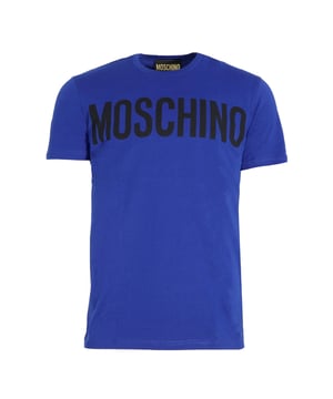 Elevate your casual wardrobe with the Moschino Bold Logo Branded Blue T-Shirt. Crafted with premium materials, this striking blue tee features Moschino's iconic bold logo, making a confident style statement wherever you go. Its comfortable fit and vibrant color ensure you stay both stylish and comfortable throughout the day. Perfect for pairing with jeans or layering under a jacket, this T-shirt adds a touch of luxury and personality to your everyday look. Make a lasting impression with Moschino's distinctive design and quality craftsmanship. Made in Portugal, 100% Cotton