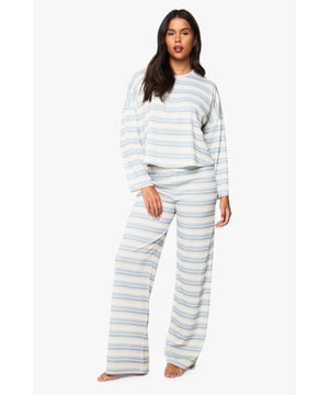 Soft ribbed knit texture for ultimate comfort and warmth
        Relaxed long-sleeve top with a casual dropped shoulder design
        Wide-leg trousers with a comfortable stretch waistband
        Stylish horizontal stripe pattern throughout the set
        Coordinated two-piece set that can be worn together or separately
    
    Transform your downtime wardrobe with this effortlessly chic ribbed loungewear set from Boohoo. The relaxed silhouette of the long-sleeved top pairs perfectly with the wide-leg trousers, creating a balanced look that flatters all body types. Perfect for those lazy Sunday mornings with a cup of tea and your favourite book, or for casual video calls when working from home. The horizontal stripe pattern adds a contemporary twist to classic loungewear, whilst the soft ribbed fabric ensures maximum comfort without compromising on style. Layer with a chunky cardigan and fluffy socks during colder months, or wear the pieces separately to create multiple looks - pair the top with denim for quick errands or the trousers with a simple vest for yoga at home. This versatile set embodies the perfect balance between comfort and on-trend style.