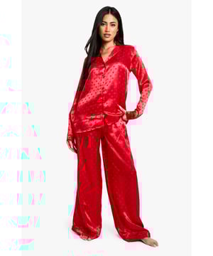 Luxurious satin fabric with charming heart-print jacquard pattern
        Relaxed fit shirt with classic collar and button-down front
        Long sleeves for cosy comfort
        Wide-leg trousers with elasticated waistband for ease of movement
        Versatile two-piece set perfect for lounging or sleeping
    
    Indulge in the ultimate night-time luxury with this stunning satin jacquard shirt and trouser set. The alluring heart-print pattern adds a touch of romance to your bedtime routine, while the soft, smooth fabric gently caresses your skin for a truly comfortable sleep. The relaxed fit of both pieces ensures unrestricted movement, whether you're curling up with a good book or catching some well-deserved shut-eye. Style this set with cosy slippers and a plush dressing gown for those chilly evenings, or wear it on its own during warmer nights. Perfect for lazy weekend mornings or impromptu video calls with friends, this versatile pyjama set effortlessly combines style and comfort. Make bedtime your most fashionable hour with this must-have addition to your nightwear collection.