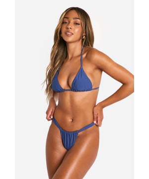Tanga-style bikini bottoms for a daring look
        Ruched front detail adds texture and interest
        Low-rise fit sits comfortably on the hips
        Minimal coverage for maximum tanning potential
        Paired with a matching triangle top for a coordinated set
    
    Make a splash this summer with these eye-catching tanga bikini bottoms from Boohoo. The ruched front detail adds a touch of sophistication to the daring silhouette, perfect for the fashion-forward beach-goer. Designed to sit low on the hips, these bottoms offer minimal coverage, ideal for achieving that perfect tan. Pair with the matching triangle top for a cohesive look that's sure to turn heads by the pool or on the beach. Whether you're jetting off to a tropical paradise or lounging at your local lido, these versatile bottoms will keep you looking stylish and feeling confident. Accessorise with oversized sunglasses and a wide-brimmed hat for the ultimate summer ensemble that transitions seamlessly from sunbathing to beachside cocktails.