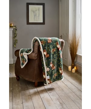 Escape to the heart of the forest with the Deyongs Woodland Wildlife Throw, available in Sage, Wine, and Navy. Each colourway features a beautifully detailed print of foxes, squirrels, owls, and foliage, capturing the serene magic of woodland life. The luxurious 220gsm flannel front offers a velvety-soft feel, while the 200gsm sherpa reverse wraps you in plush warmth—perfect for cosy evenings indoors. Measuring 140x180cm and made from 100% polyester, this throw is machine washable and ideal for adding rustic charm and comfort to your sofa, armchair, or bed.