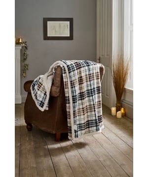 Add a classic touch of warmth to your living space with the Deyongs Balwin Tartan Throw in Navy & Choco. Featuring a timeless plaid design in soft shades of navy, chocolate brown, and cream, this throw brings a cozy, heritage-inspired feel to any room. Crafted with a smooth 220gsm printed flannel front and a plush 200gsm sherpa reverse, it offers the perfect balance of comfort and style. Generously sized at 140x180cm and made from 100% polyester, it’s ideal for layering on your sofa or bed—and fully machine washable for effortless care.