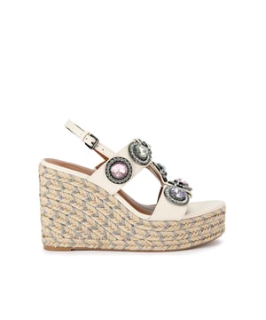 The Octavia Espadrille Wedge heel features a bone leather upper with large pastel crystals across the cage style upper. There is a rope effect to the wedge heel with pastel metallic thread running through. Heel height: 10.5cm.