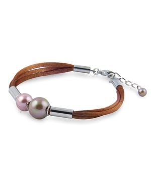 Alcudia Bracelet with Majorcan Pearls: a natural contrast with an artisanal soul.\n\n This bracelet combines the luster of Mallorcan pearls in various shades with soft, natural-finished cords, creating a balanced and distinctive piece. A perfect fusion of tradition and contemporary style.\n\n Details:\n - Handcrafted in Mallorca using the traditional method.\n - Polished Mallorcan pearls, set in harmonious contrast.\n - Soft-touch leather-effect cord with a warm, flexible finish.\n - Metallic joining details with a glossy finish.\n - Lobster clasp with extension chain.\n\n A versatile and distinctive bracelet that combines natural textures with timeless elegance. Ideal for those who appreciate artisanal craftsmanship and seek a unique touch for their everyday or weekend looks.\n Measures: Minimum length: 20 cm. Maximum length: 25cm\n Composition: Synthetic suede\n Care:\nAvoid contact with perfumes, creams and chemicals.