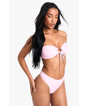 Strapless bandeau top with elegant pearl embellishment at centre front
        Adjustable tie detail for a customised fit and stylish look
        Knitted fabric offers comfortable stretch and shape retention
        Mid-rise bikini bottoms with clean, seamless finish
        Versatile two-piece design perfect for mixing and matching with other swimwear
    
    Make a statement poolside with this chic bandeau bikini set from Boohoo. The striking pearl detail adds a touch of glamour to this otherwise minimalist design, whilst the adjustable tie front allows you to create your perfect fit. The knitted fabric moulds beautifully to your figure, ensuring both comfort and style throughout your holiday. Pair with oversized sunglasses and a flowing kimono for casual beach days, or style with a sheer maxi skirt and metallic sandals for sunset cocktails at the beach bar. This versatile two-piece works brilliantly as a foundation for your holiday wardrobe, easily transitioning from daytime sunbathing to evening promenade strolls with just a few accessory changes.