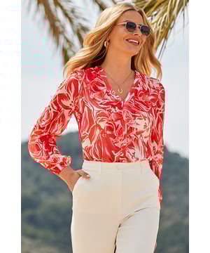 This one's made for complimentsSpun from dreamy georgette fabricComfy relaxed fit drapes softly over the bodyFinished with blouson sleeves and a romantic ruffle detailElevate your office tailoringTuck it into white denim for day-to-night drinks n