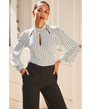 Cue the "where did you get that top?" comments
Chic-meets-sexy twist keyhole neck
Soft fabric for comfort and style
Beautiful blouson sleeves
Spots are always in style
We love it with a leather skirt