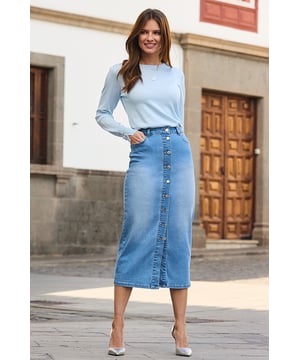 You'll wonder how you ever lived without itWe make our denim with the perfect amount of stretch Cut for a flattering column silhouette Trending longline hem Finished with a statement button-front detail Style with a nice top and knee-highs